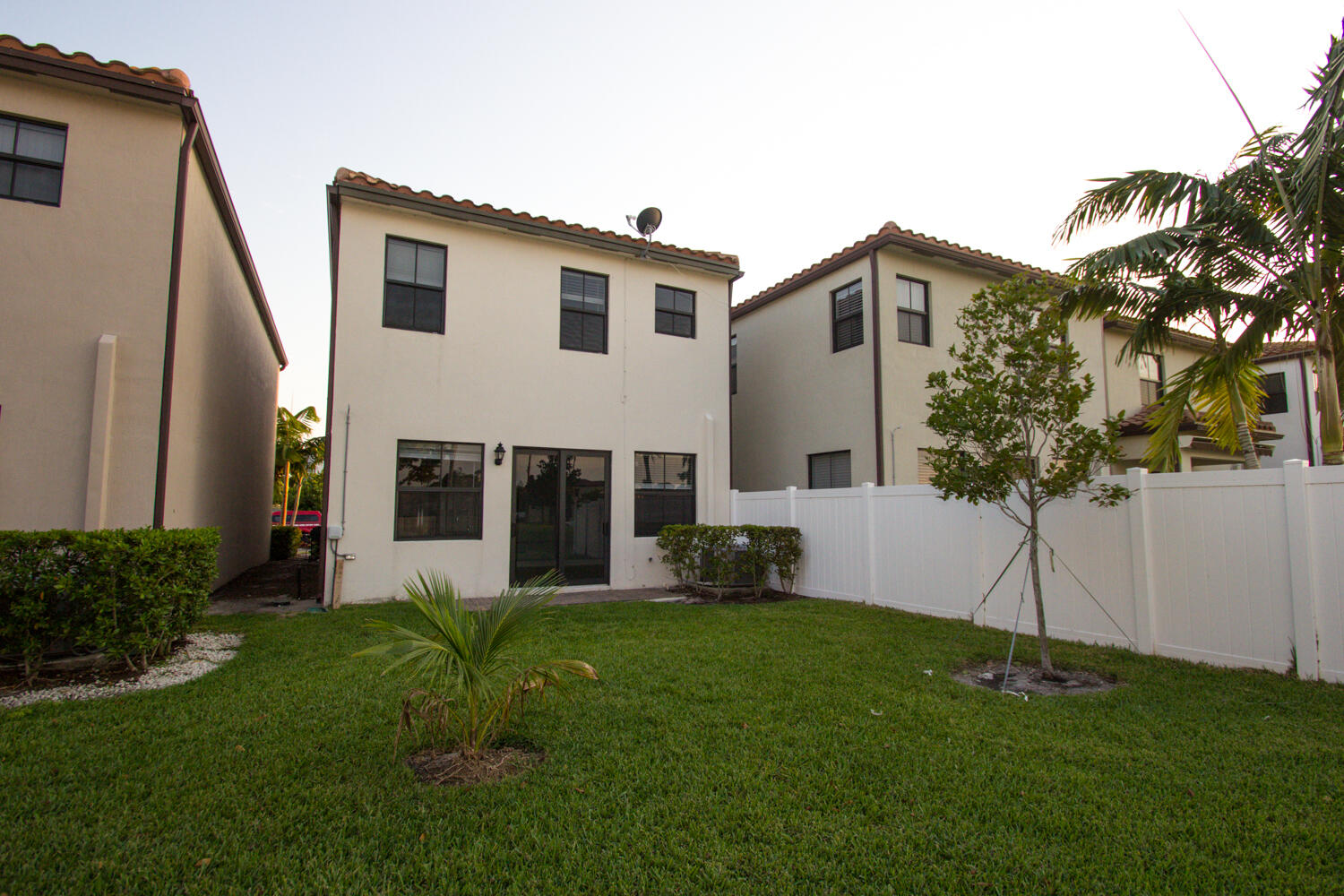 6022 Pine Tree Way Riviera Beach, FL 33410 - Photo 17 of 18 Back view of home