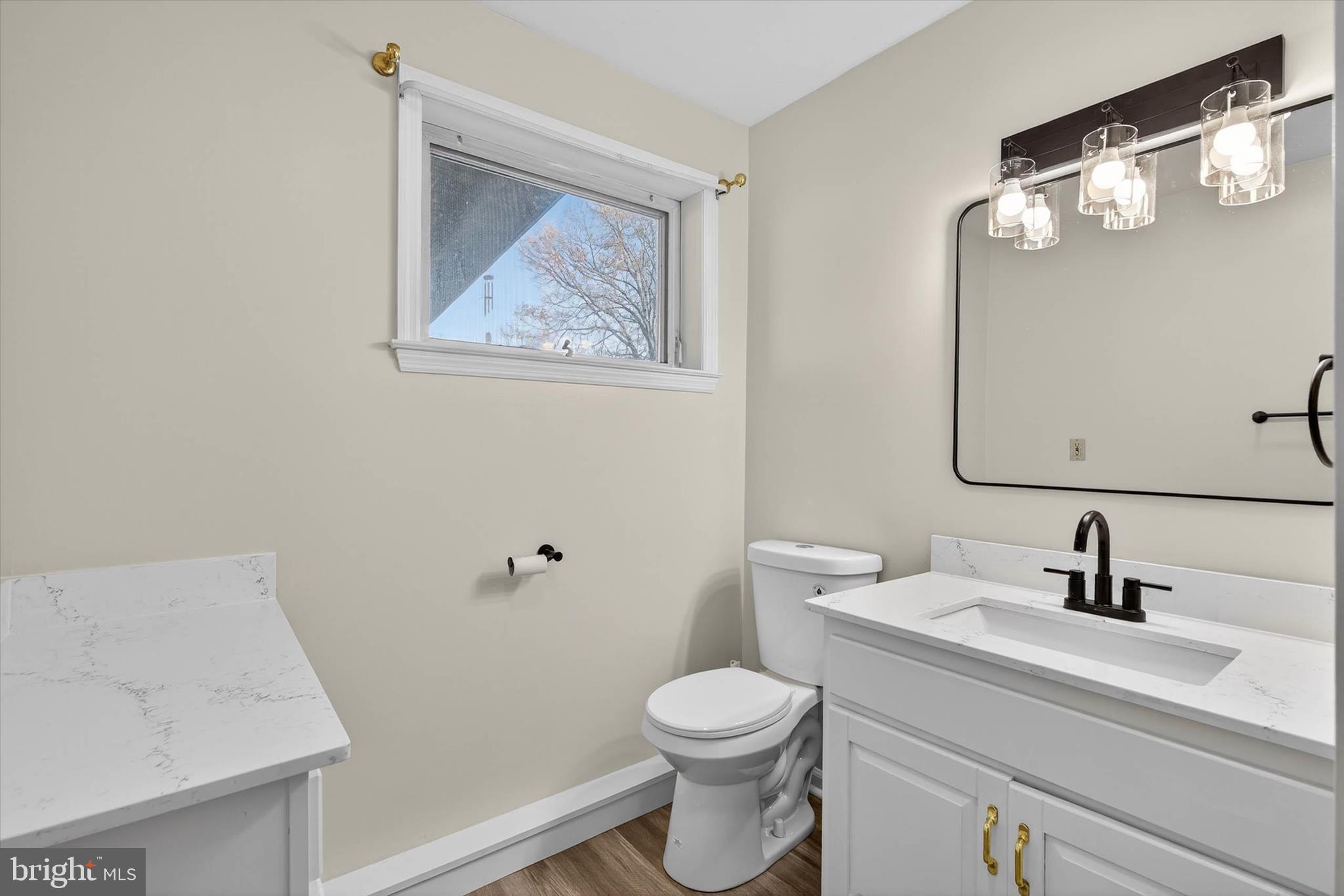 27 Rosemont Avenue Reading, PA 19607 - Photo 28 of 54 a bathroom with a toilet a sink and mirror