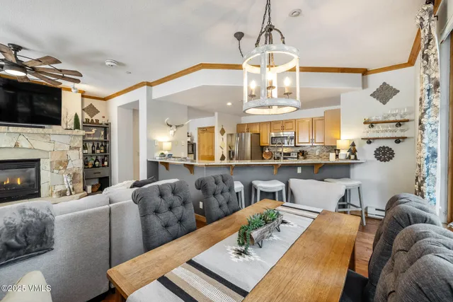 a living room with fireplace furniture and a flat screen tv