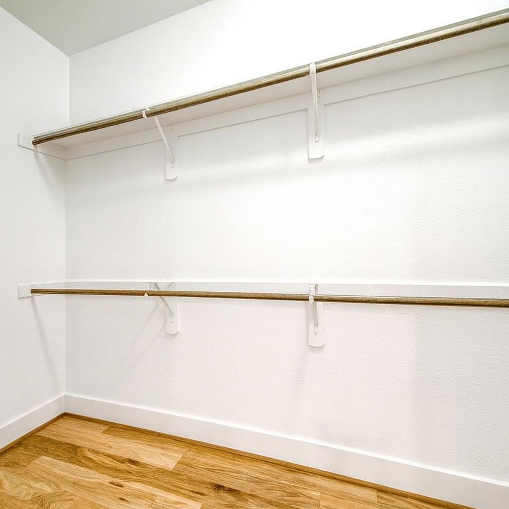 908 Nueces Street, Unit 18 Austin, TX 78701 - Photo 14 of 24 Walk in closet with light wood finished floors