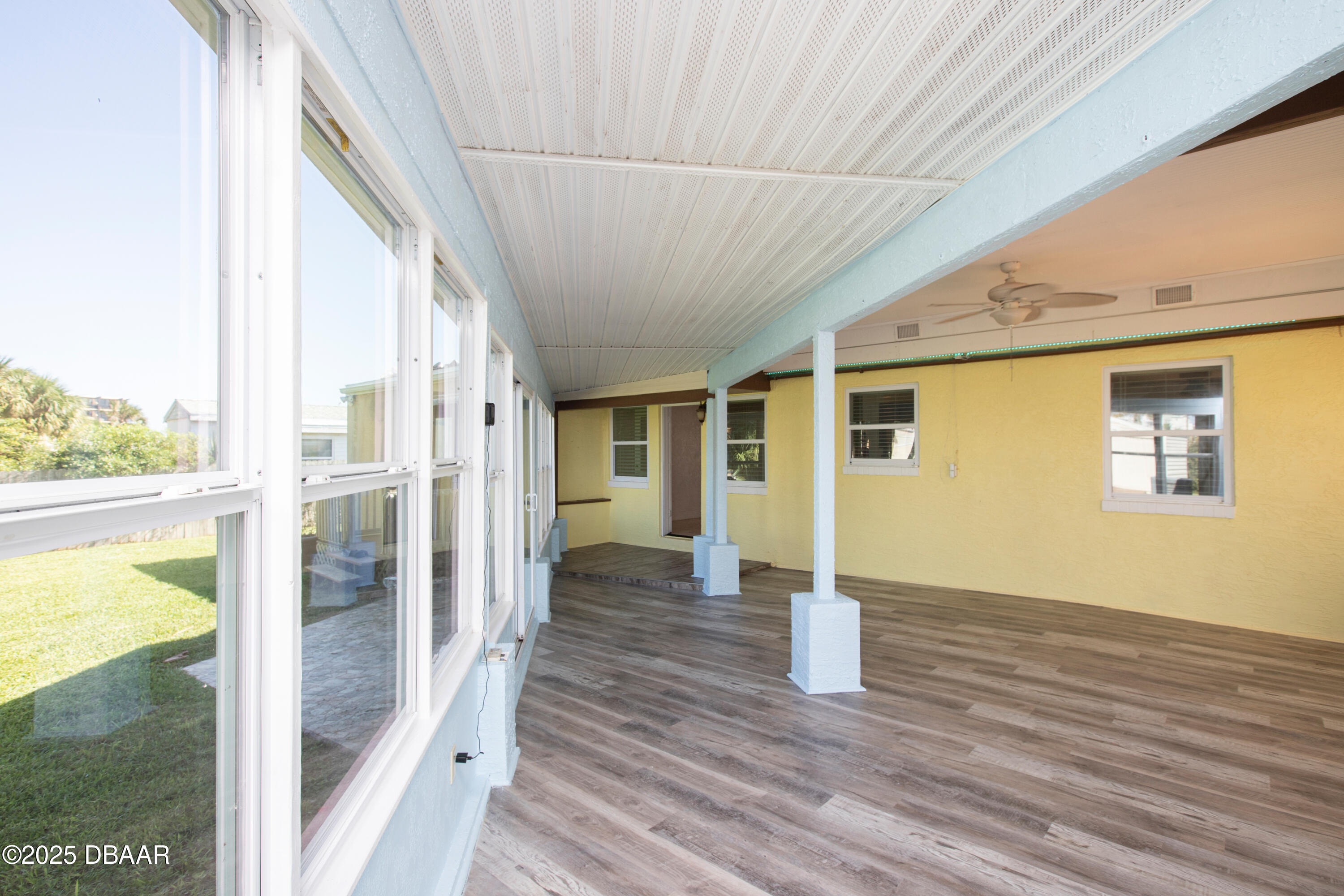 131 Minerva Road Daytona Beach, FL 32118 - Photo 20 of 21 a view of a porch with wooden floor and fence
