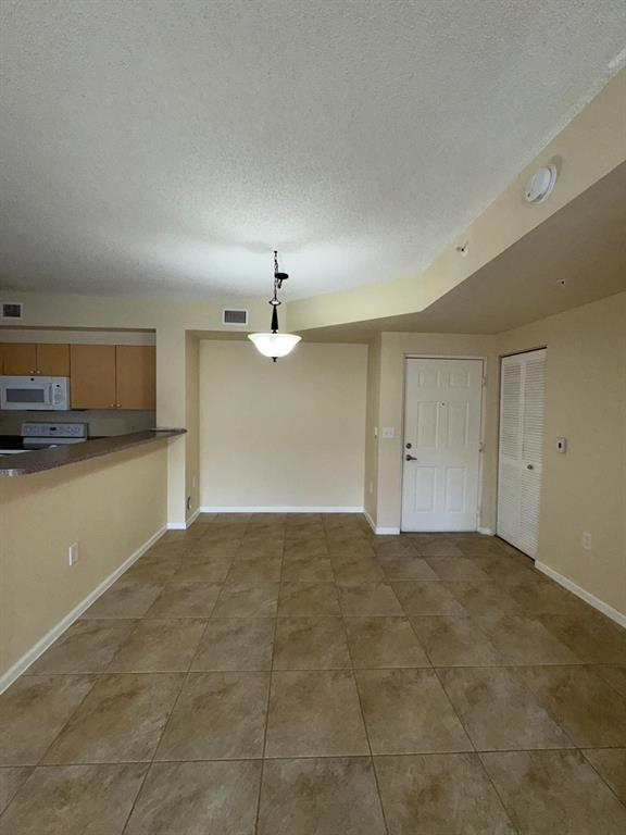 8060 North Nob Hill Road, Unit 106 Tamarac, FL 33321 - Photo 11 of 15 a view of a kitchen with a sink and dishwasher kitchen view