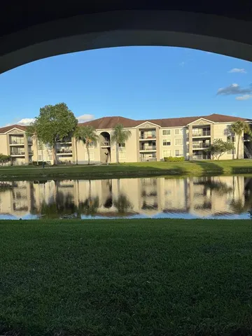 a view of a building with a yard