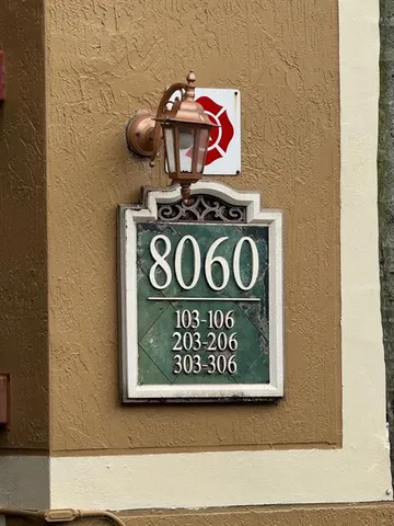 a view of a wooden wall with sign on wall
