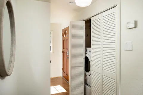 a bathroom with a shower and a window