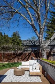 a view of a patio with chair and tables