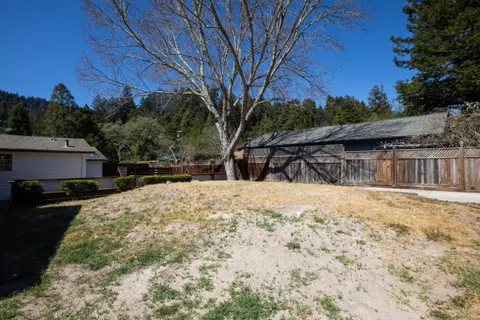 a view of a backyard of the house