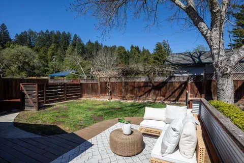 a backyard of a house with seating space