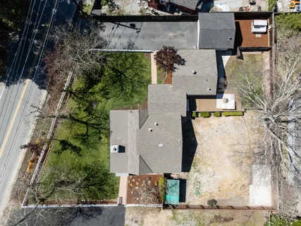 an aerial view of residential houses with outdoor space