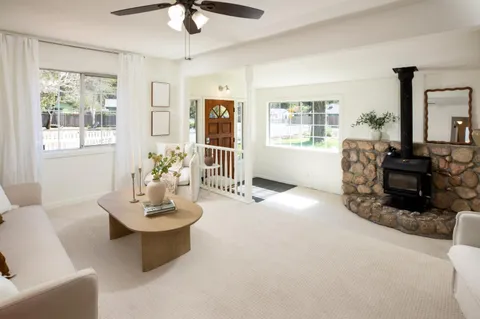 a living room with furniture and window