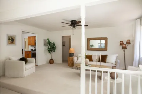 a bedroom with furniture and a window
