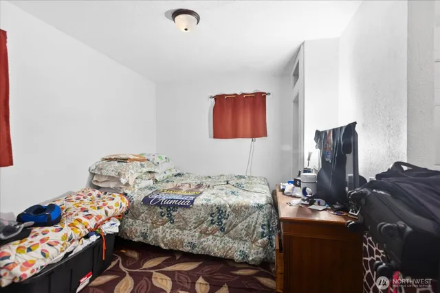 a bedroom with a bed and furniture