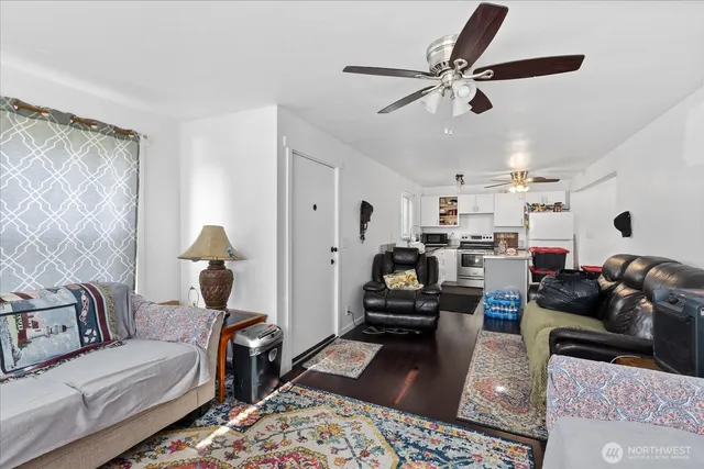 a living room with furniture and a rug