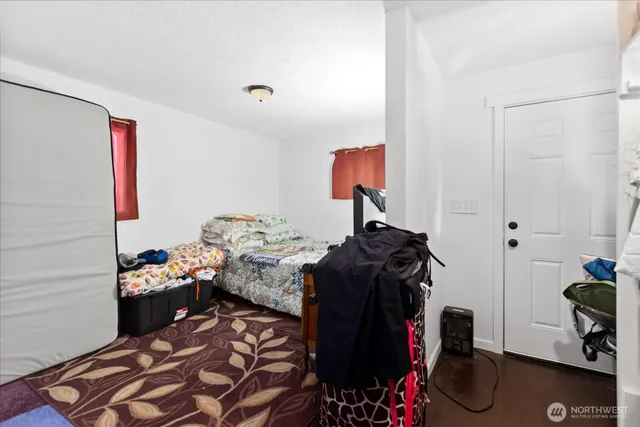 a bedroom with a bed and a closet