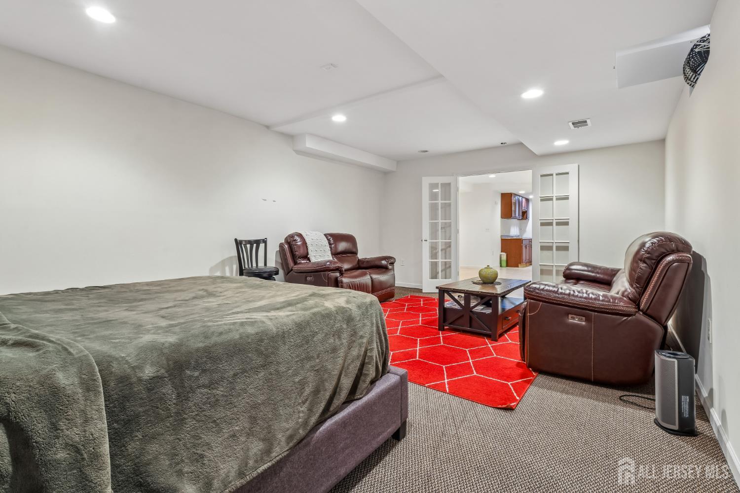 489 Plainfield Road Edison, NJ 08820 - Photo 33 of 39 a spacious bedroom with a bed and a couch