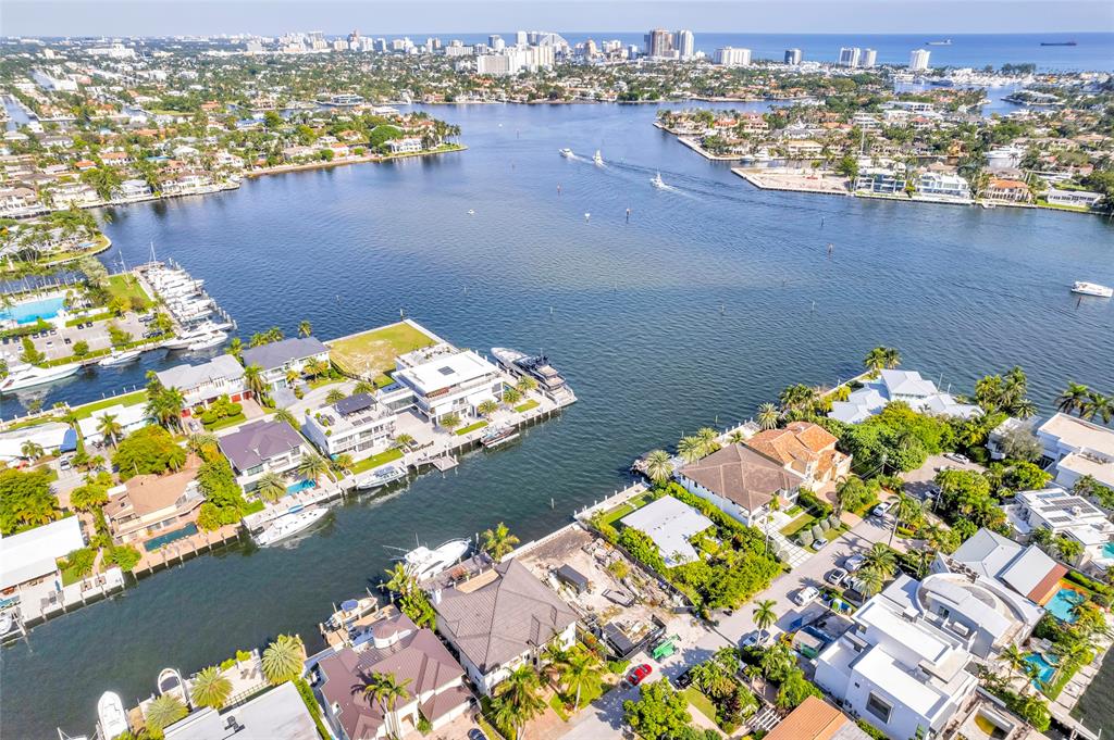 an aerial view of a house with a lake view