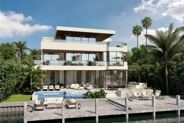 a front view of a house with swimming pool and sitting area