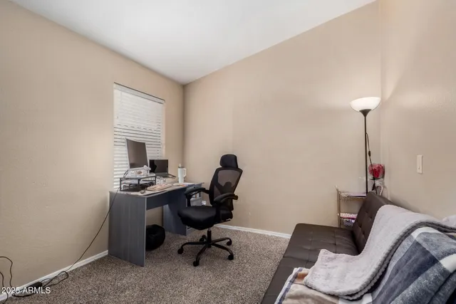 a view of workspace room with lounge chair