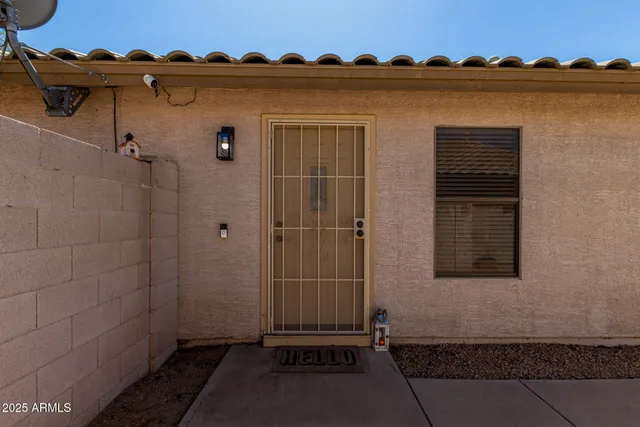 a view of a house with backyard and wooden floor