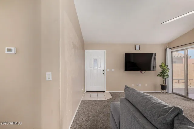 a living room with a couch and a flat screen tv
