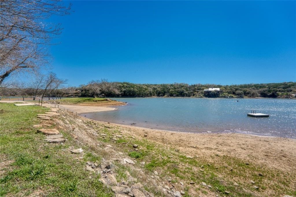 Tbd Spring Street Burnet, TX 78611 - Photo 11 of 17 a view of a lake with houses in the background