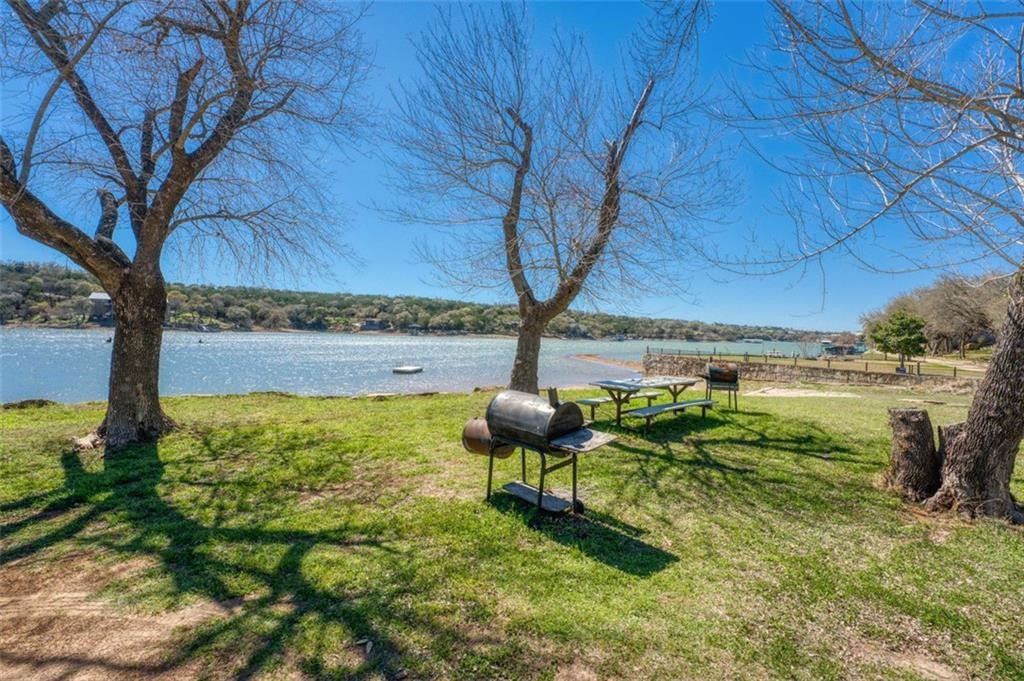 Tbd Spring Street Burnet, TX 78611 - Photo 8 of 17 a backyard of a house with table and chairs