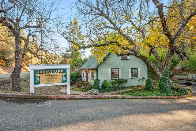 front view of a house with a street