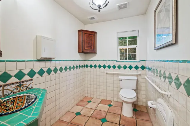 a kitchen with sink cabinets and window
