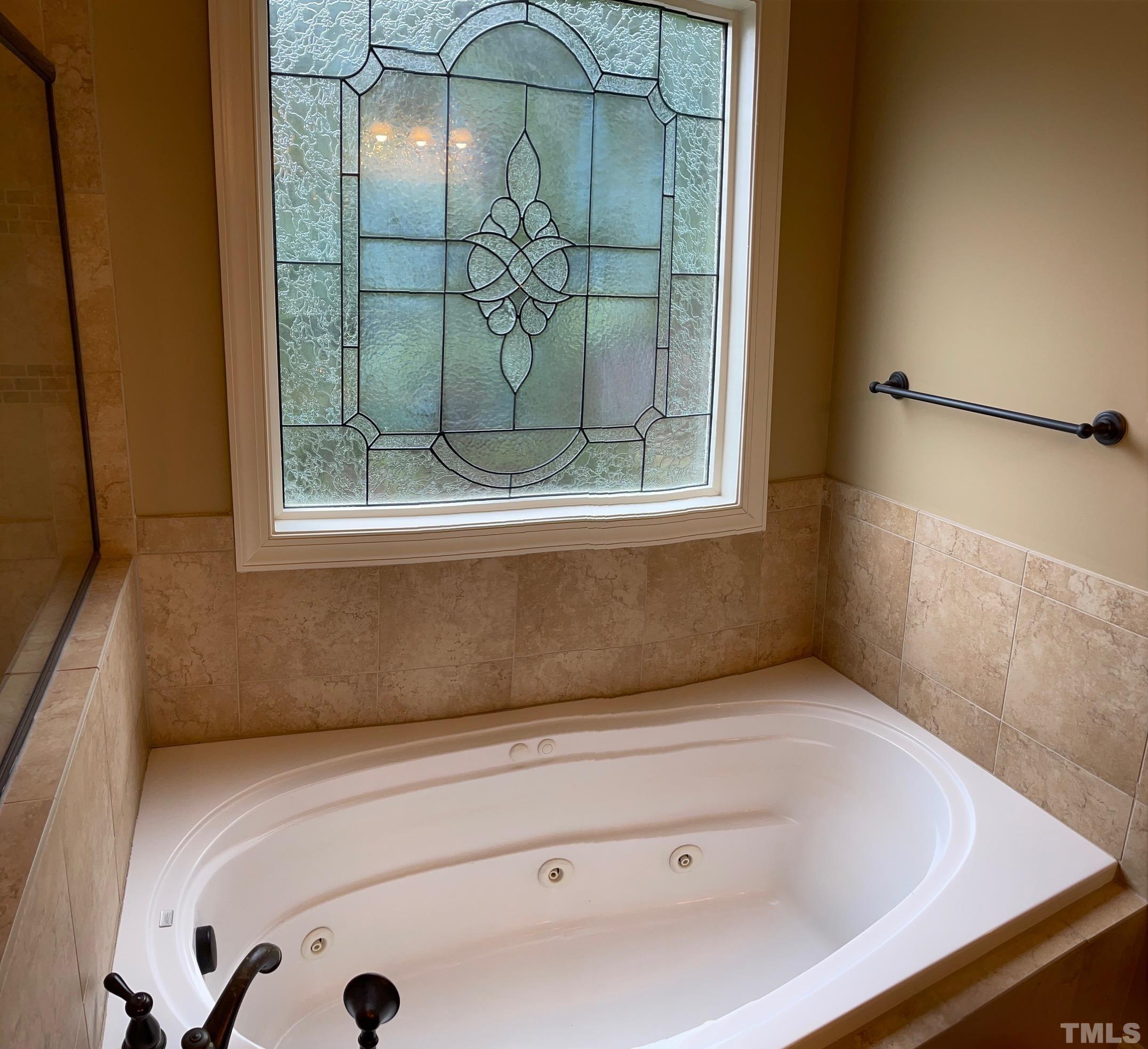 72 Silverside Drive Angier, NC 27501 - Photo 16 of 28 a bathroom with a bathtub and shower