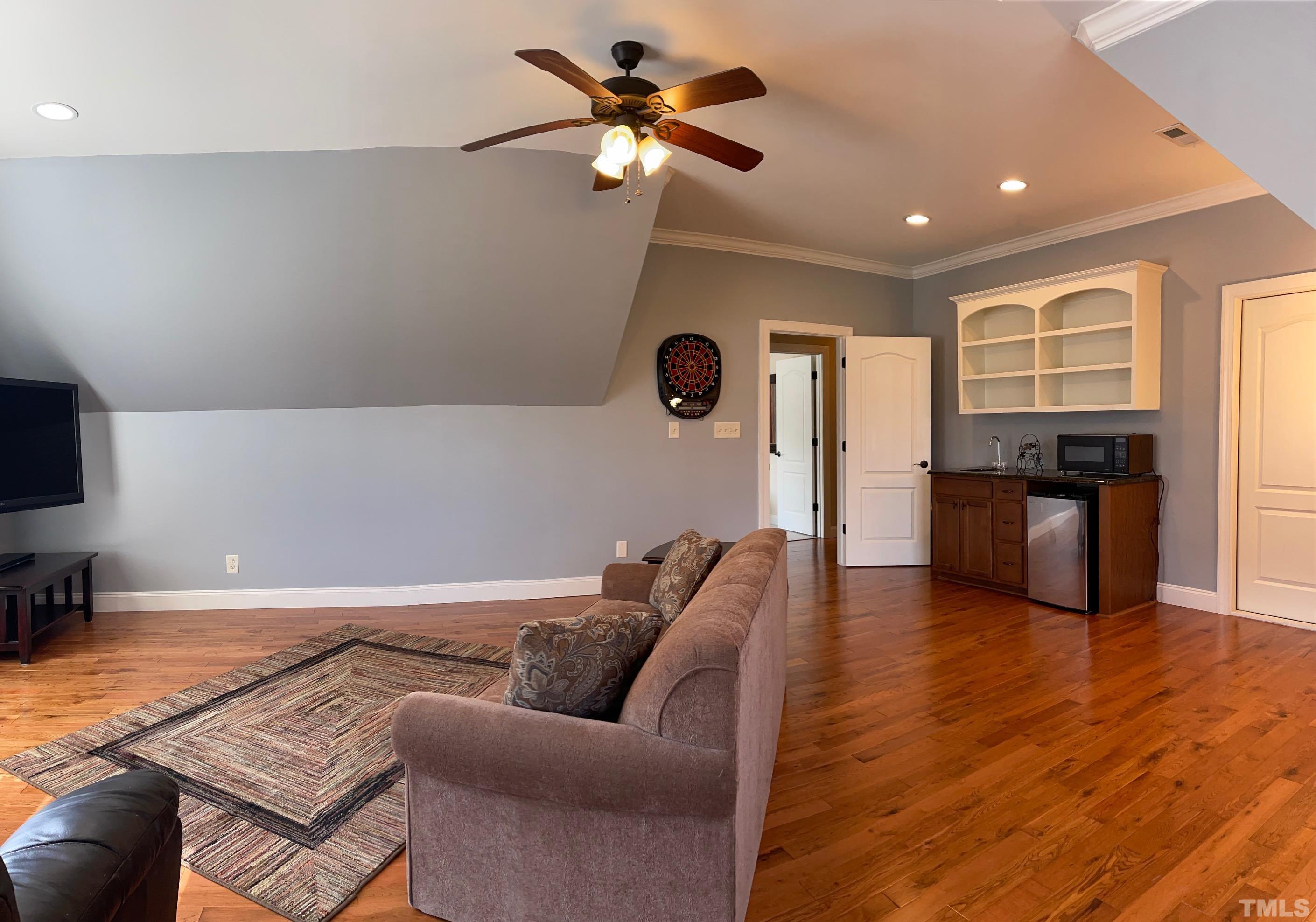 72 Silverside Drive Angier, NC 27501 - Photo 22 of 28 a living room with furniture and kitchen