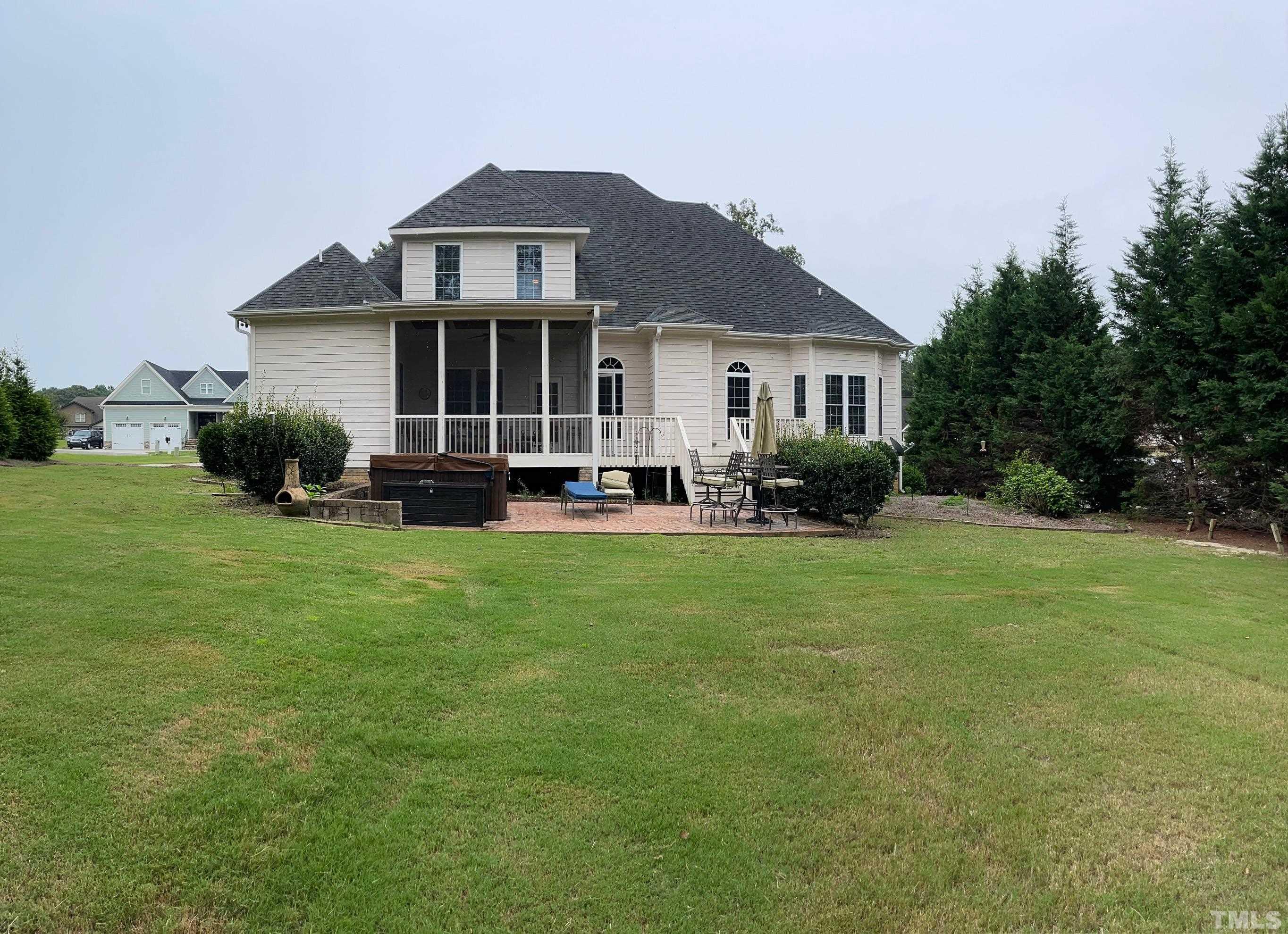72 Silverside Drive Angier, NC 27501 - Photo 26 of 28 a front view of a house with a yard and trees