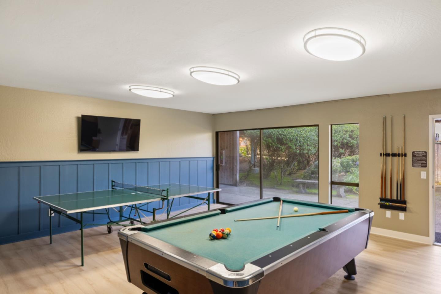 1 Surf Way, Unit 216 Monterey, CA 93940 - Photo 16 of 21 a room with furniture pool table and glass door