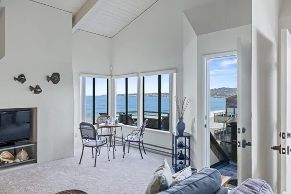 a view of a livingroom with furniture and a flat screen tv