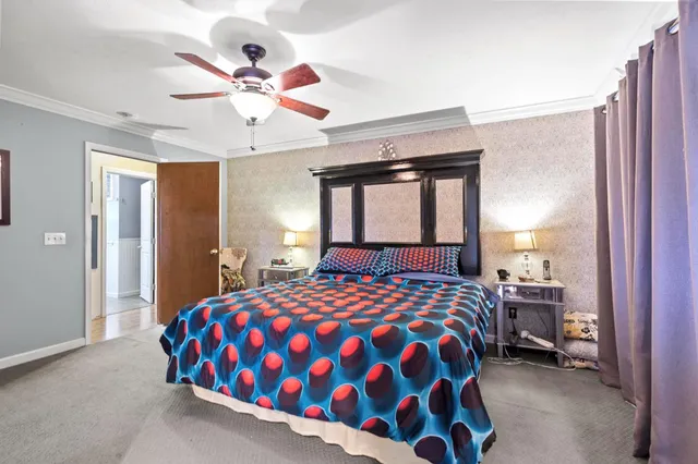 a spacious bathroom with a granite countertop tub sink and mirror