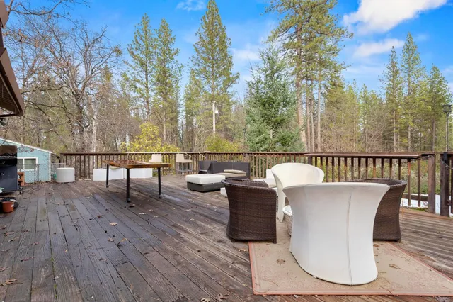 a view of a swimming pool with a yard