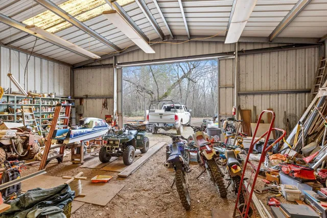 a aerial view of a house with garden space and patio