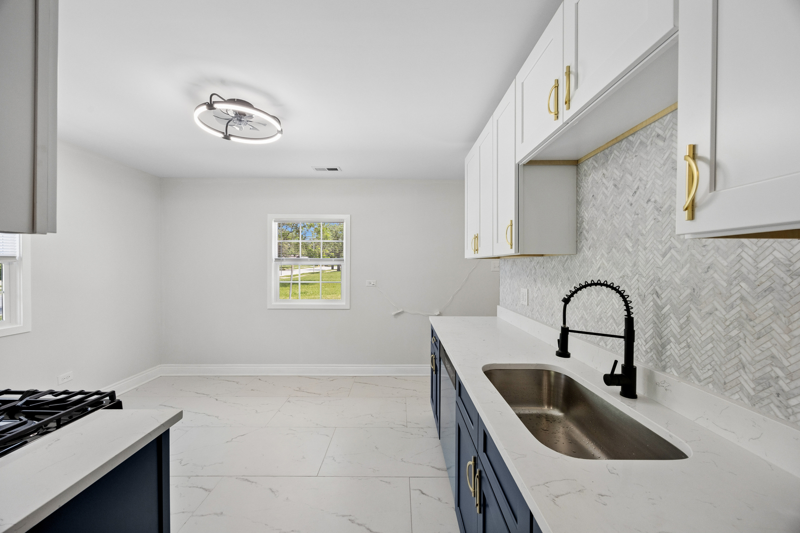 570 Andover Street Chicago Heights, IL 60411 - Photo 10 of 22 a kitchen with a sink a stove and cabinets