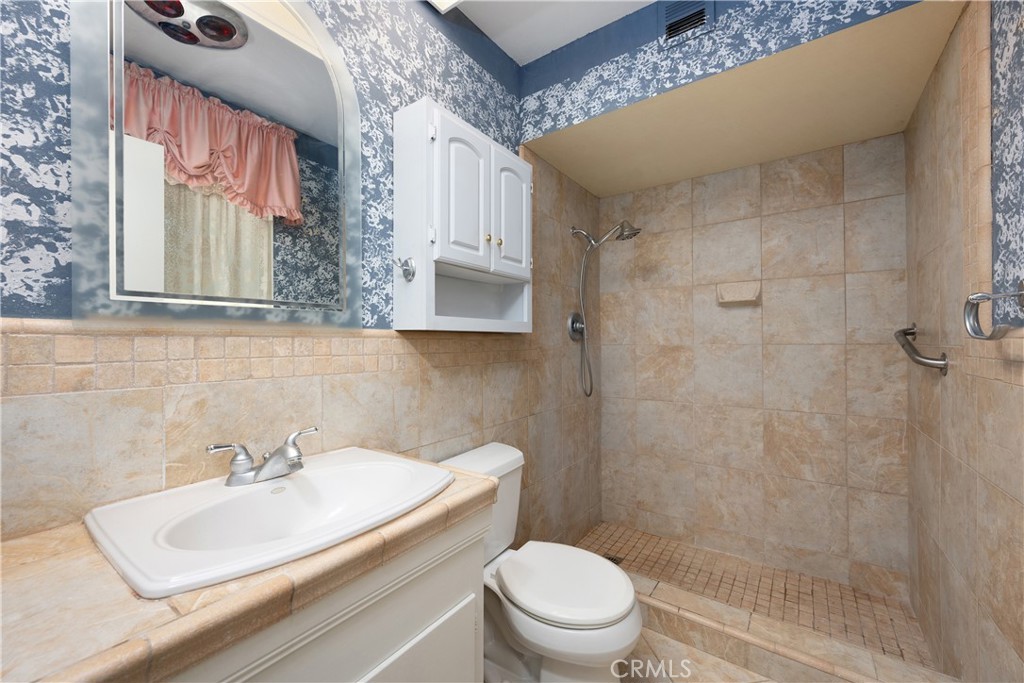 28839 Carmel Road Menifee, CA 92586 - Photo 20 of 47 a bathroom with a sink a toilet and shower