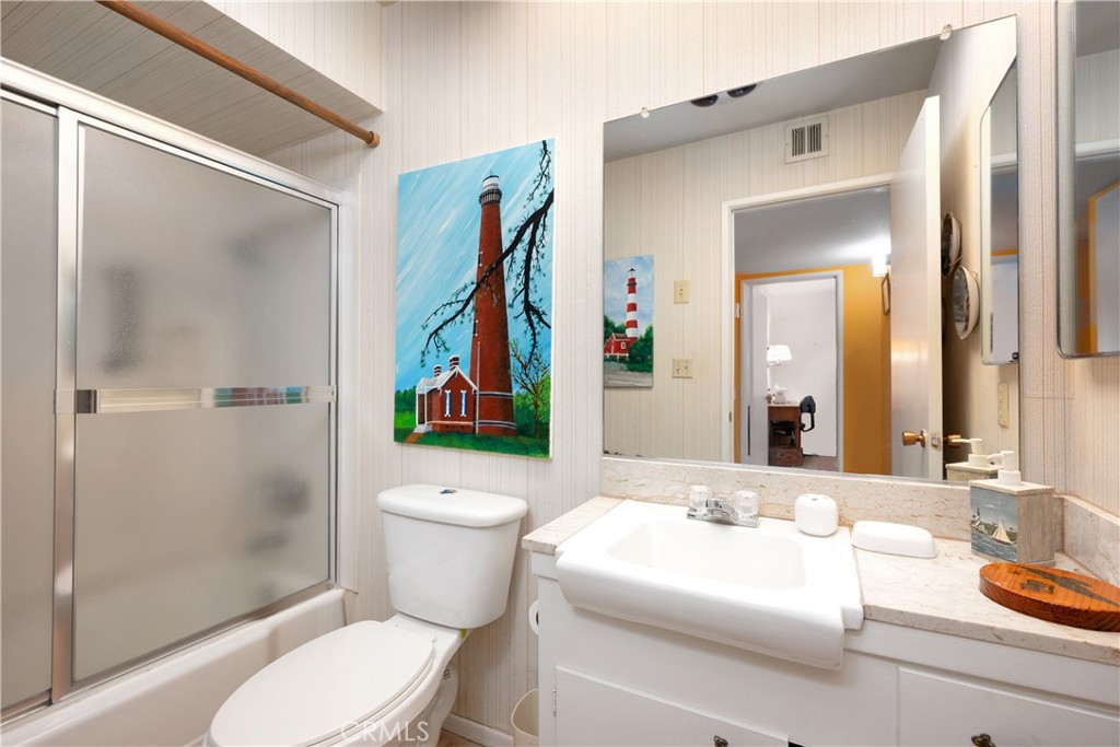 28839 Carmel Road Menifee, CA 92586 - Photo 21 of 47 a bathroom with a sink toilet and shower