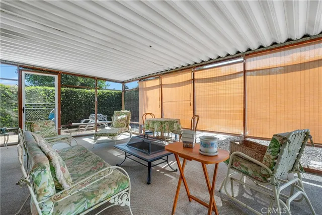 a room with furniture and a large window