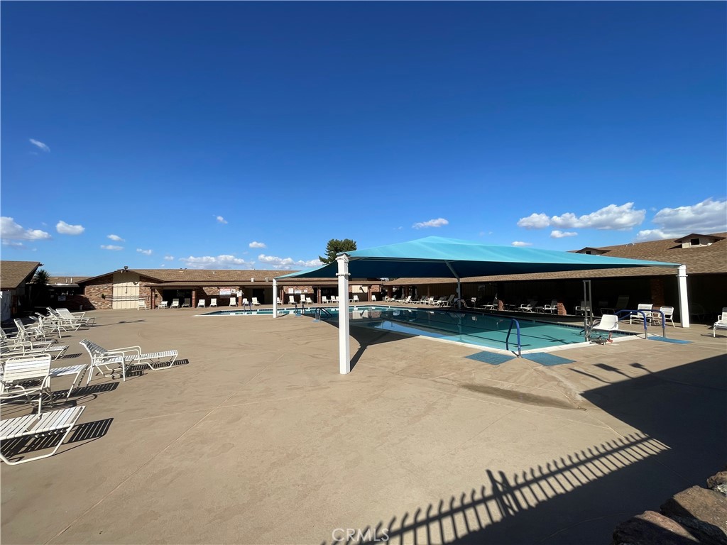 28839 Carmel Road Menifee, CA 92586 - Photo 36 of 47 a view of a swimming pool with outdoor seating