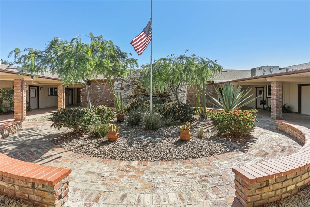 28839 Carmel Road Menifee, CA 92586 - Photo 40 of 47 a view of a house with a yard and potted plants