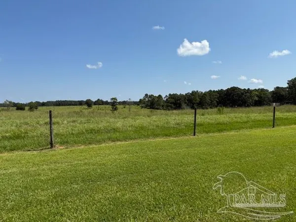 a view of a golf course with a lake