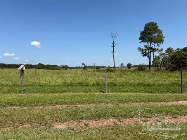 a view of a lake with a big yard