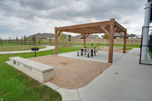an outdoor space with furniture and garden
