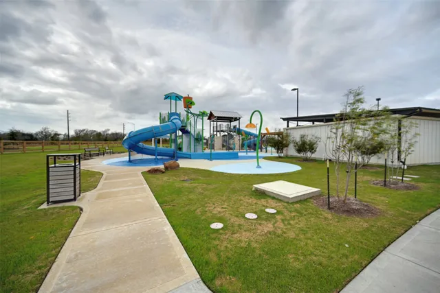 swimming pool view with a garden space