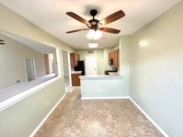 a view of a kitchen with a sink and a window