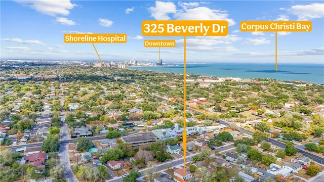 a kitchen with granite countertop a sink a stove and cabinets