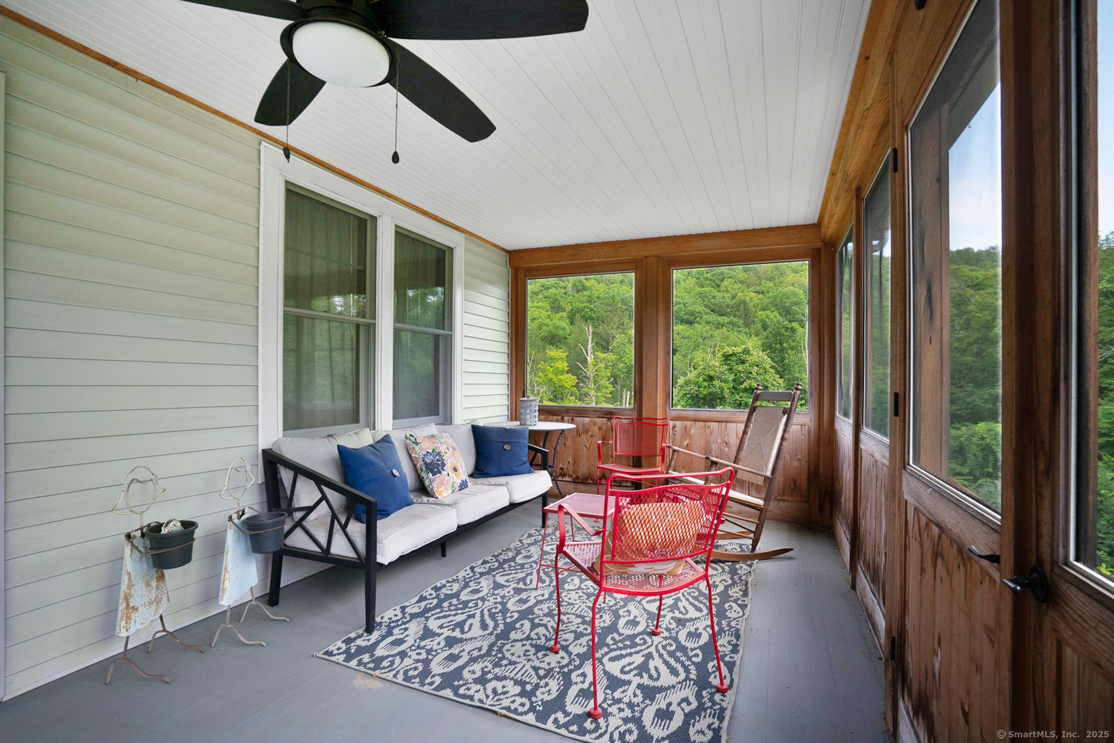 2 Valley Road Washington, CT 06777 - Photo 13 of 32 a living room with furniture and a floor to ceiling window