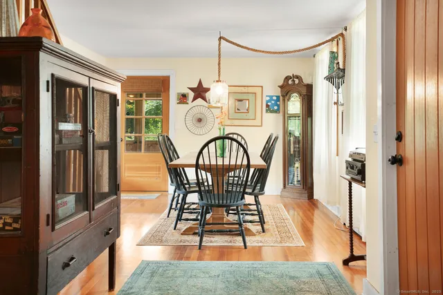 a view of a very nice looking dining room with furniture window and outside view